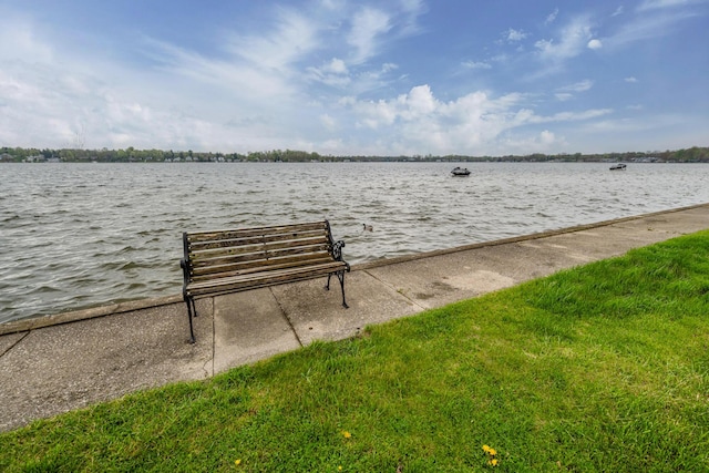 surrounding community with a water view