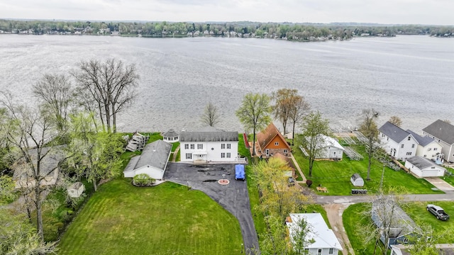 bird's eye view featuring a water view and a residential view