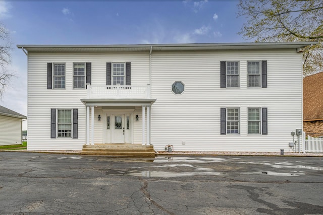 view of front of property with a balcony
