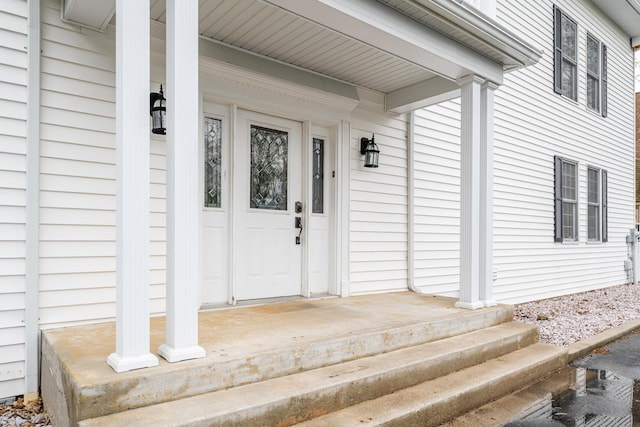 entrance to property featuring a porch
