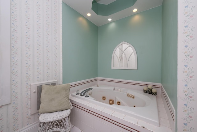 bathroom with heating unit, recessed lighting, and a whirlpool tub