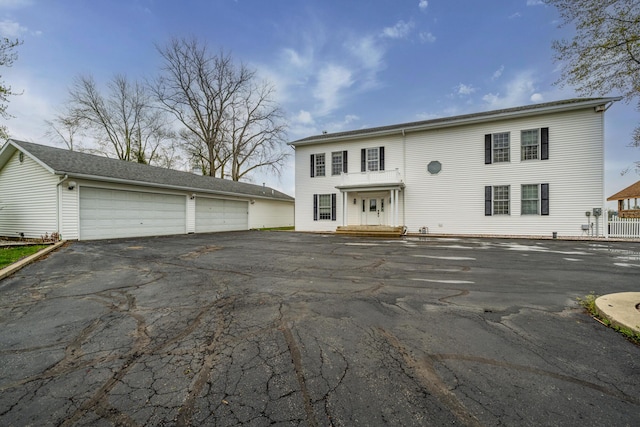 view of front of home with an outbuilding and a detached garage