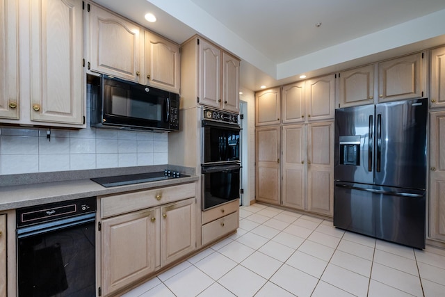 kitchen with recessed lighting, light tile patterned floors, backsplash, black appliances, and light countertops
