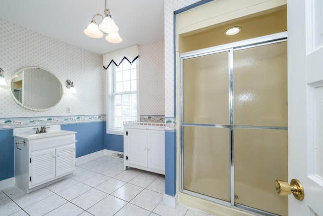 bathroom featuring wallpapered walls, a stall shower, and an inviting chandelier