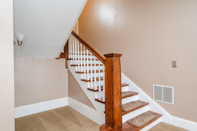 staircase with carpet, visible vents, and baseboards
