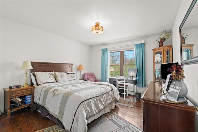 bedroom featuring wood finished floors