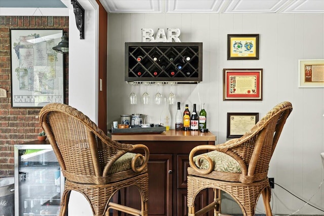bar with brick wall, a decorative wall, and a dry bar