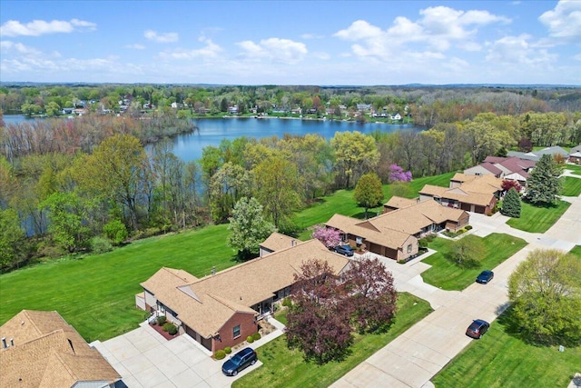 birds eye view of property with a water view and a residential view