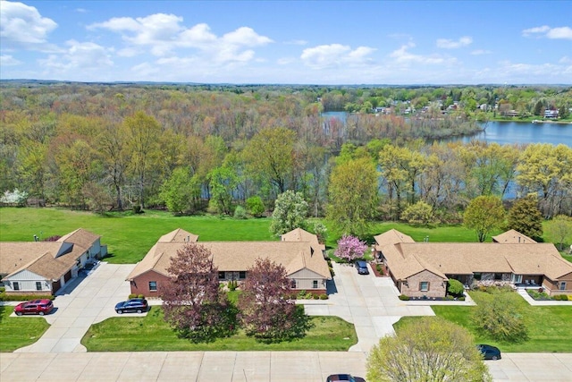 aerial view featuring a water view and a view of trees