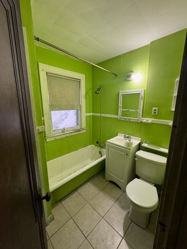bathroom with tile patterned flooring, toilet, shower / tub combination, and vanity