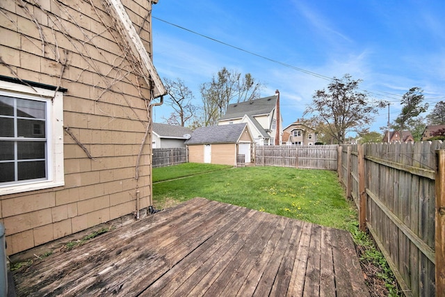 1009 S Webster St, Jackson, MI 49203 - deck featuring an outdoor structure and a shed