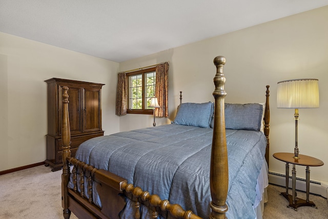 bedroom featuring baseboards, baseboard heating, and light colored carpet