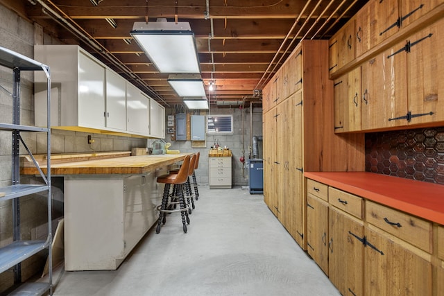 below grade area with concrete block wall