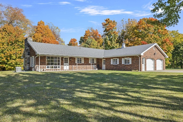 ranch-style house featuring a chimney, central AC, brick siding, and a garage