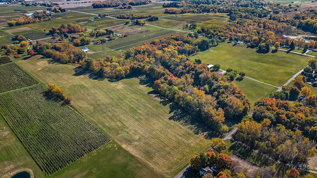 birds eye view of property with a rural view