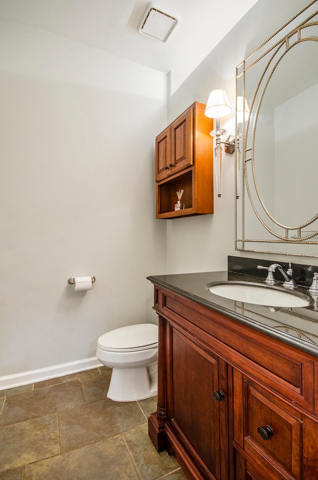 5401 Lone Pine Ct, Brighton, MI 48116 - half bath with toilet, baseboards, vanity, and stone finish flooring