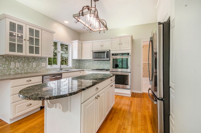 5401 Lone Pine Ct, Brighton, MI 48116 - kitchen with appliances with stainless steel finishes, a sink, a center island, white cabinetry, and recessed lighting
