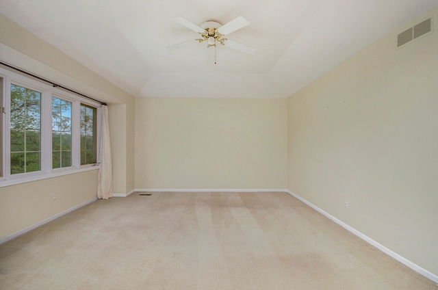 5401 Lone Pine Ct, Brighton, MI 48116 - empty room featuring light carpet, baseboards, ceiling fan, and a tray ceiling