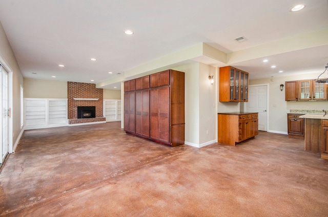 5401 Lone Pine Ct, Brighton, MI 48116 - unfurnished living room with recessed lighting, baseboards, finished concrete flooring, and a fireplace