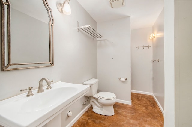 5401 Lone Pine Ct, Brighton, MI 48116 - bathroom with a sink, finished concrete flooring, toilet, and baseboards