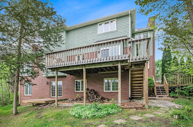 5401 Lone Pine Ct, Brighton, MI 48116 - rear view of house featuring stairs, a deck, brick siding, and a chimney