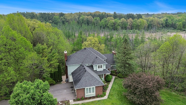 5401 Lone Pine Ct, Brighton, MI 48116 - aerial view of property and surrounding area with a forest