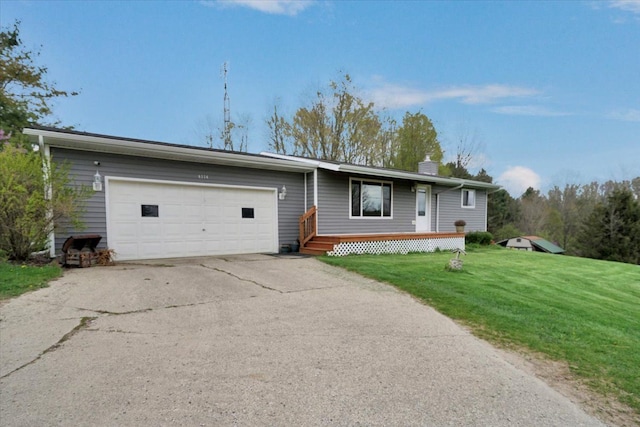 ranch-style home featuring a front lawn, driveway, a chimney, and a garage