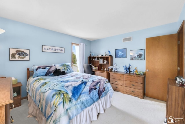 bedroom featuring light carpet