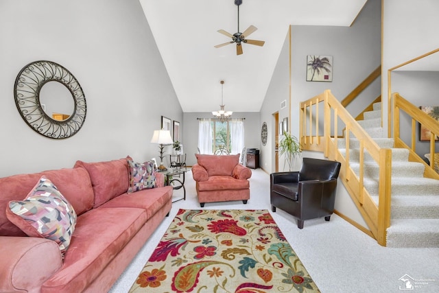 living room with carpet flooring, high vaulted ceiling, a chandelier, stairs, and ceiling fan
