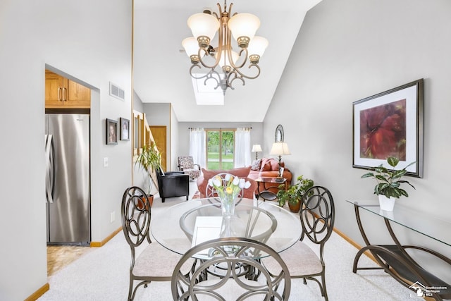 dining area featuring baseboards, light carpet, a chandelier, and high vaulted ceiling