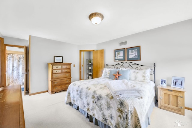 bedroom with carpet flooring, baseboards, and a closet