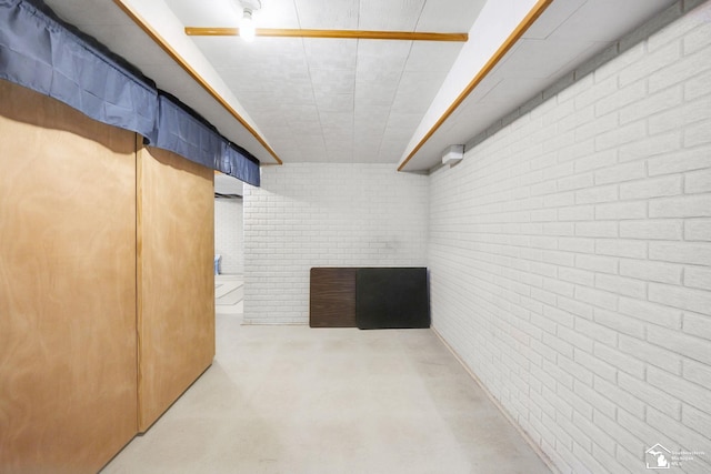 finished below grade area with brick wall
