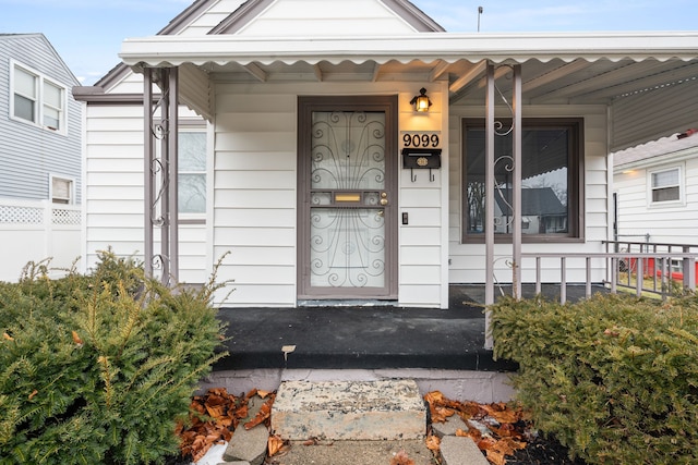 entrance to property with a porch