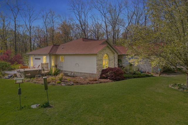 3370 Breezewood, Ortonville, MI 48462 - view of side of home with an attached garage and a lawn