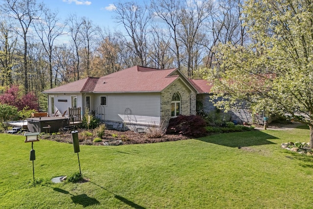 3370 Breezewood, Ortonville, MI 48462 - view of front of home featuring a hot tub, an attached garage, and a front lawn