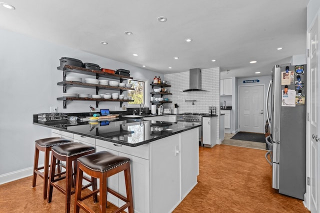 3370 Breezewood, Ortonville, MI 48462 - kitchen with stainless steel appliances, wall chimney range hood, open shelves, white cabinets, and a peninsula