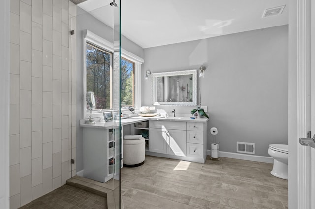 3370 Breezewood, Ortonville, MI 48462 - full bath featuring vanity, toilet, and wood finished floors