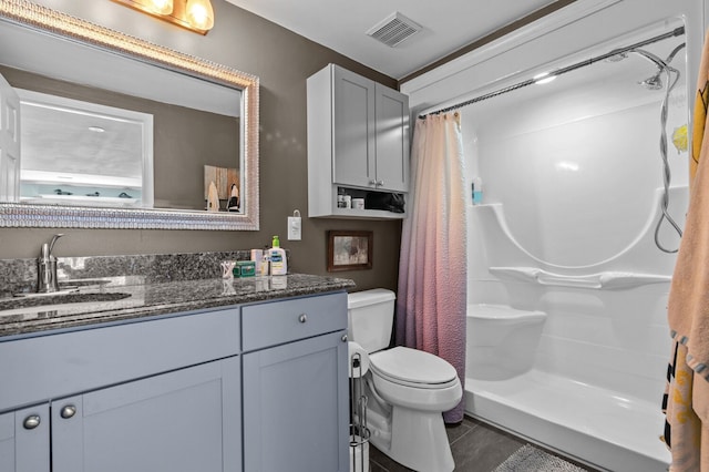3370 Breezewood, Ortonville, MI 48462 - bathroom featuring a shower stall, tile patterned floors, vanity, and toilet
