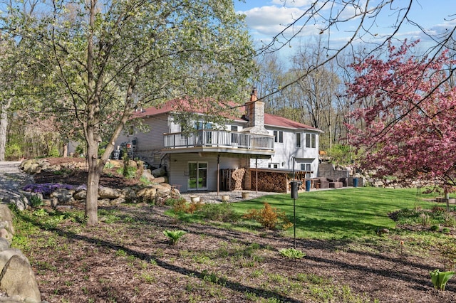 3370 Breezewood, Ortonville, MI 48462 - back of property with a wooden deck, a lawn, a chimney, and cooling unit