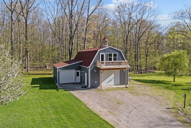 3370 Breezewood, Ortonville, MI 48462 - detached garage with driveway and a view of trees