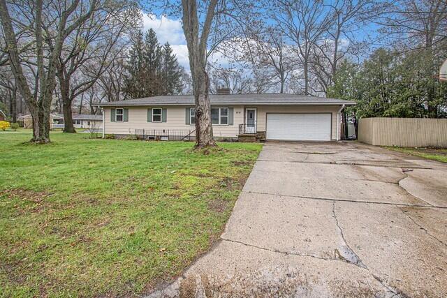 2737 Patricia Dr, Muskegon, MI 49445 - ranch-style home featuring a garage and concrete driveway