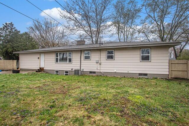 2737 Patricia Dr, Muskegon, MI 49445 - rear view of house with a chimney and entry steps