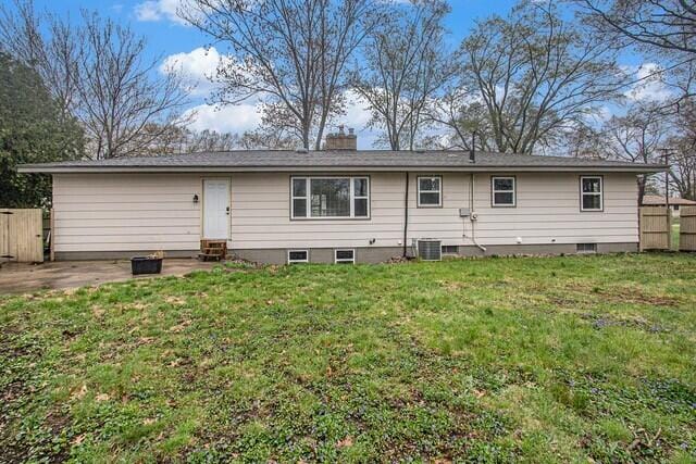 2737 Patricia Dr, Muskegon, MI 49445 - back of house featuring a chimney and entry steps