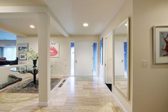foyer entrance featuring baseboards and recessed lighting