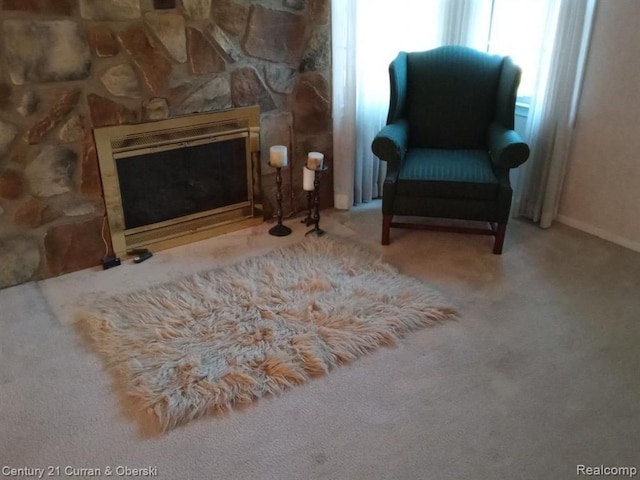23211 Myrtle St, Dearborn, MI 48128 - living area featuring a stone fireplace and carpet