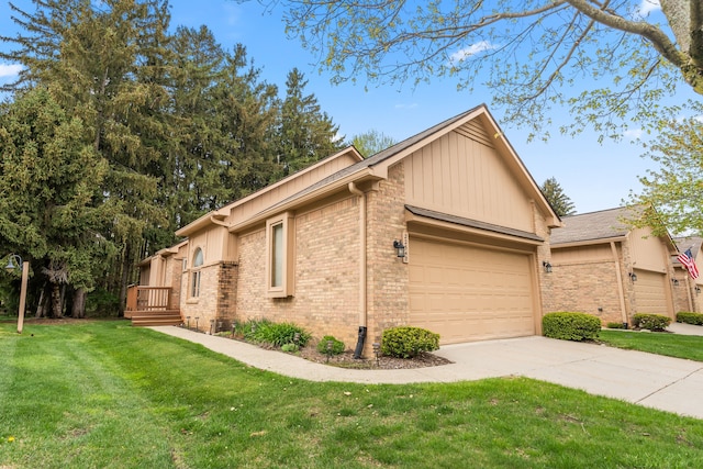 view of property exterior featuring a yard, brick siding, a garage, and concrete driveway