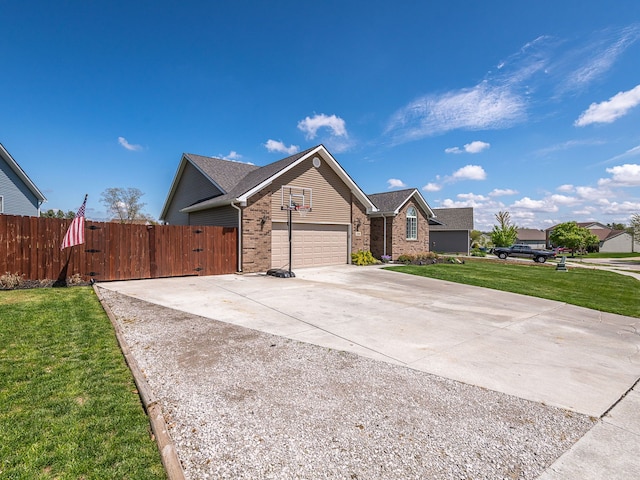 ranch-style home featuring a front lawn, brick siding, fence, and a garage