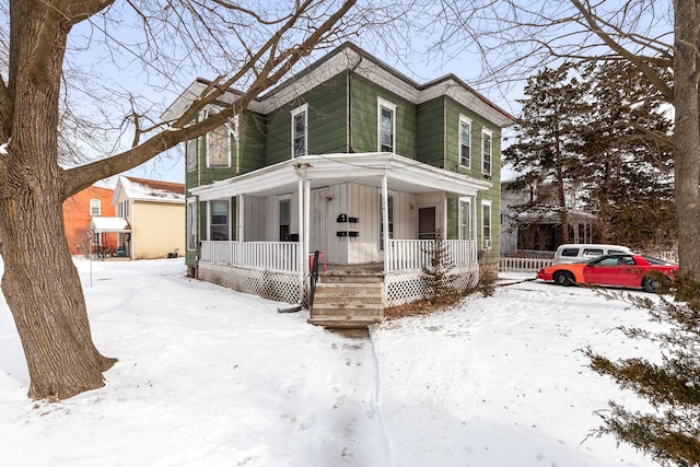 124 S Ottawa St, Tecumseh, MI 49286 - view of front of home with a porch and board and batten siding