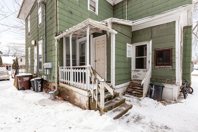 124 S Ottawa St, Tecumseh, MI 49286 - view of snow covered property entrance