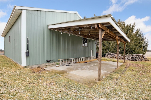 view of property exterior featuring a patio area and a carport